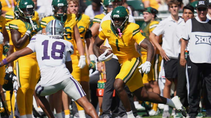 Oct 4, 2025; Waco, Texas, USA;  Baylor Bears tight end Michael Trigg (1) runs after the catch against Kansas State Wildcats safety Wesley Fair (18) during the first half at McLane Stadium. Mandatory Credit: Chris Jones-Imagn Images