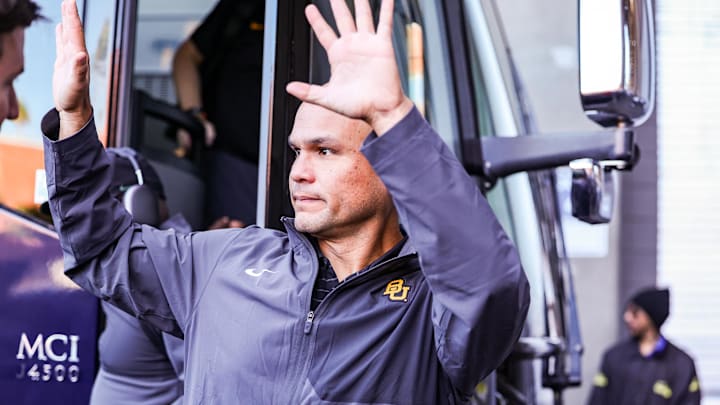 Nov 22, 2025; Tucson, Arizona, USA; Baylor Bears head coach Dave Aranda waves to fans after he gets off the bus before the start of the game against the Arizona Wildcats at Casino Del Sol Stadium. Mandatory Credit: Aryanna Frank-Imagn Images