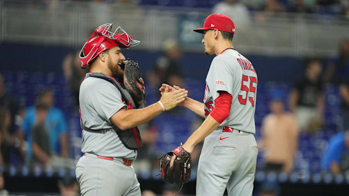 Aug 19, 2025; Miami, Florida, USA;  St. Louis Cardinals catcher Pedro Pagés (43) celebrates a win with pitcher Riley O'Brien (55) against the Miami Marlins at loanDepot Park. Mandatory Credit: Jim Rassol-Imagn Images