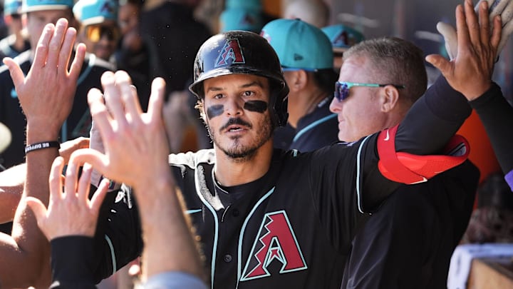 Arizona Diamondbacks' Nolan Arenado (28) reacts after hitting a home run off Colorado Rockies pitcher Antonio Senzatela (49) in the second inning during a spring training game at Salt River Fields on Feb. 20, 2026, in Scottsdale.