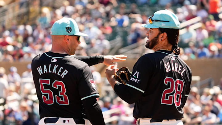 Arizona Diamondbacks Christian Walker talks to Eugenio Suárez against the Seattle Mariners in the third inning during a spring training game at Salt River Fields on March 22, 2024. Arizona Diamondbacks Christian Walker talks to Eugenio Suárez against the Seattle Mariners in the third inning during a spring training game at Salt River Fields on March 22, 2024.