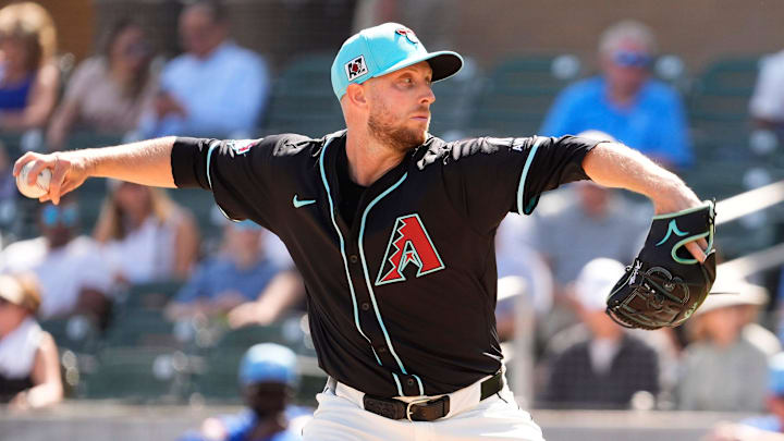 Arizona Diamondbacks pitcher Merrill Kelly throws to the Kansas City Royals in the first inning during a spring training game at Salt River Fields at Talking Stick on Feb. 28, 2025, in Scottsdale. Arizona Diamondbacks pitcher Merrill Kelly throws to the Kansas City Royals in the first inning during a spring training game at Salt River Fields at Talking Stick on Feb. 28, 2025, in Scottsdale.