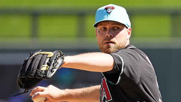 Arizona Diamondbacks pitcher Corbin Burnes warms up before facing the Milwaukee Brewers in the first inning of a spring training game on Feb. 26, 2025, in Scottsdale at Salt River Fields at Talking Stick.