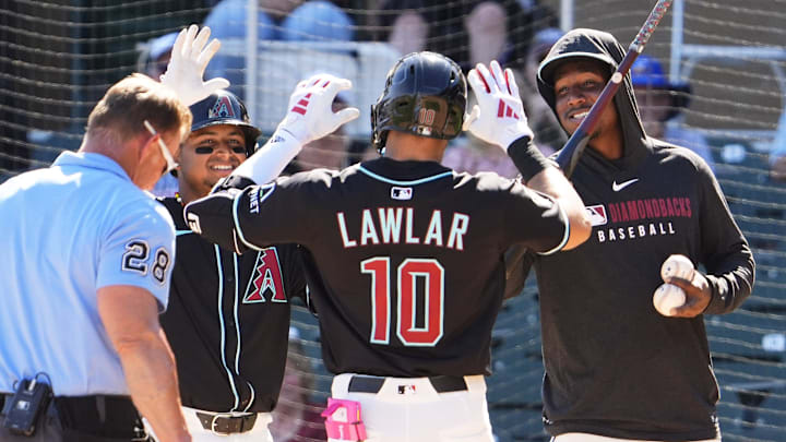 Arizona Diamondbacks Jordan Lawlar celebrates with Gabriel Moreno and Geraldo Perdomo after hitting a two-run home run off Milwaukee Brewers pitcher Tyler Alexander in the second inning of a spring training game on Feb. 26, 2025, in Scottsdale at Salt River Fields at Talking Stick. Arizona Diamondbacks Jordan Lawlar celebrates with Gabriel Moreno and Geraldo Perdomo after hitting a two-run home run off Milwaukee Brewers pitcher Tyler Alexander in the second inning of a spring training game on Feb. 26, 2025, in Scottsdale at Salt River Fields at Talking Stick.