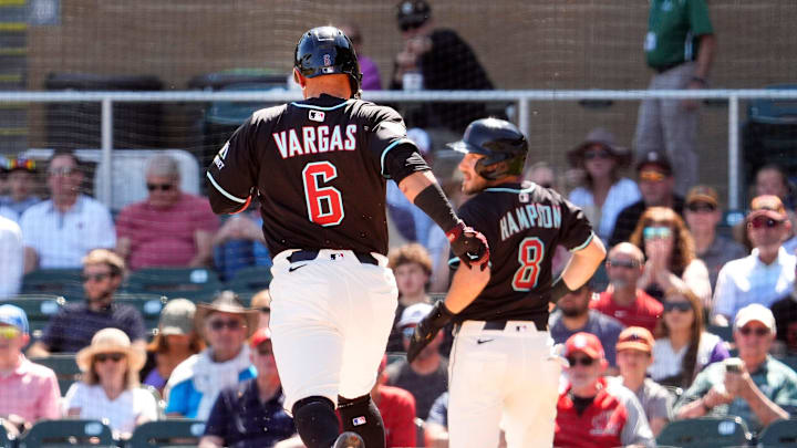 Arizona Diamondbacks Ildemaro Vargas and Garrett Hampson score on a single by Pavin Smith against the Athletics in the first inning during a spring training game at Salt River Fields in Scottsdale on March 20, 2025. Arizona Diamondbacks Ildemaro Vargas and Garrett Hampson score on a single by Pavin Smith against the Athletics in the first inning during a spring training game at Salt River Fields in Scottsdale on March 20, 2025.