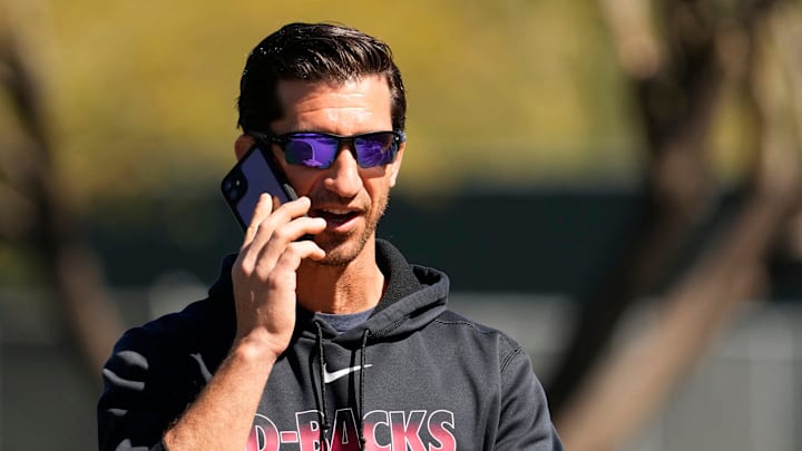 Mar 15, 2022; Scottsdale, Arizona, USA; Arizona Diamondbacks general manager Mike Hazen talks on his phone during spring training at Salt River Fields.

Mlb Diamondbacks Spring Training