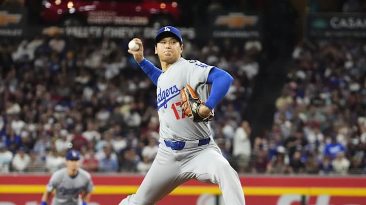 Los Angeles Dodgers pitcher Shohei Ohtani (17) throws to the Arizona Diamondbacks in the first inning at Chase Field in Phoenix on Sept. 23, 2025.
