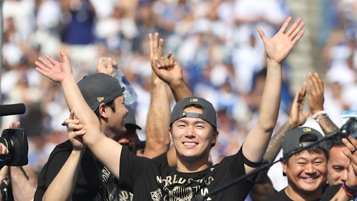 World Series MVP Yoshinobu Yamamoto has his arms raised by Shohei Ohtani during the 2025 World Series championship celebration at Dodger Stadium in Los Angeles on Monday, Nov. 3, 2025.