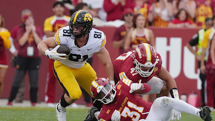 Iowa Hawkeyes tight end DJ Vonnahme (81) makes a catch around Iowa State Cyclones' defensive back Marcus Neal Jr.(31) and linebacker Kooper Ebel (47) during the fourth quarter in the Cy-Hawk football at Jack Trice Stadium on Sept. 6, 2025, in Ames, Iowa