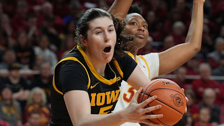 Iowa Hawkeyes center Ava Heiden (5) drives to the basket around Iowa State Cyclones' forward Alisa Williams (3) during the first quarter in the NCAA women’s basketball Cy-Hawk Series on Dec. 10, 2025, at Hilton Coliseum in Ames, Iowa. Iowa Hawkeyes center Ava Heiden (5) drives to the basket around Iowa State Cyclones' forward Alisa Williams (3) during the first quarter in the NCAA women’s basketball Cy-Hawk Series on Dec. 10, 2025, at Hilton Coliseum in Ames, Iowa.