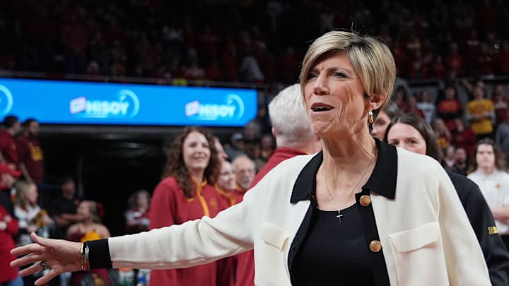 Iowa Hawkeyes women' basketball head coach Jan Jensen gets greeting from Iowa State Bench before the game in the NCAA women’s basketball Cy-Hawk Series on Dec. 10, 2025, at Hilton Coliseum in Ames, Iowa.