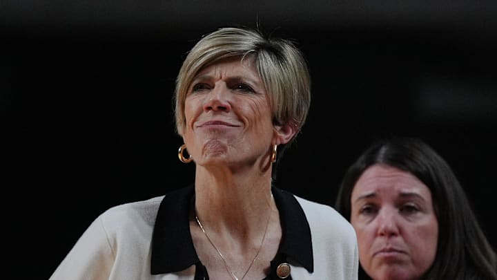 Iowa Hawkeyes women' basketball head coach Jan Jensen watches during the first quarter against Iowa State in the NCAA women’s basketball Cy-Hawk Series on Dec. 10, 2025, at Hilton Coliseum in Ames, Iowa.