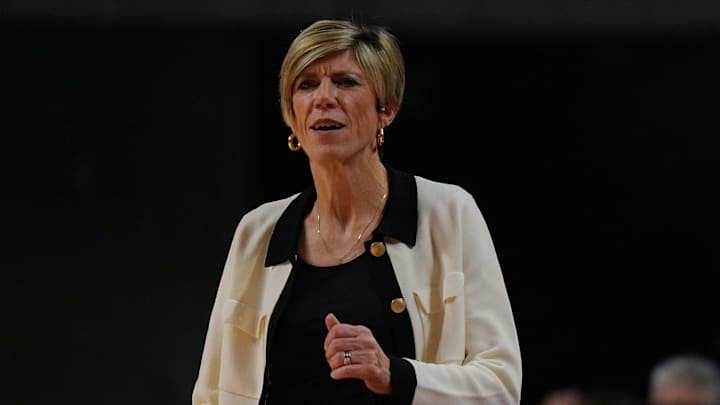 Iowa Hawkeyes women' basketball head coach Jan Jensen watches during the first quarter against Iowa State in the NCAA women’s basketball Cy-Hawk Series on Dec. 10, 2025, at Hilton Coliseum in Ames, Iowa.