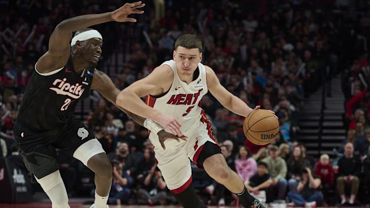 Jan 11, 2025; Portland, Oregon, USA; Miami Heat forward Nikola Jovic (5) drives to the basket during the second half against Portland Trail Blazers center Duop Reath (26) at Moda Center. Mandatory Credit: Troy Wayrynen-Imagn Images Jan 11, 2025; Portland, Oregon, USA; Miami Heat forward Nikola Jovic (5) drives to the basket during the second half against Portland Trail Blazers center Duop Reath (26) at Moda Center. Mandatory Credit: Troy Wayrynen-Imagn Images