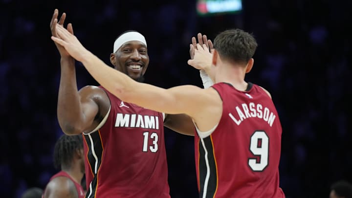 Nov 24, 2025; Miami, Florida, USA; Miami Heat center Bam Adebayo (13) and Miami Heat guard Pelle Larsson (9) celebrate the win over the Dallas Mavericks at Kaseya Center. Mandatory Credit: Jim Rassol-Imagn Images