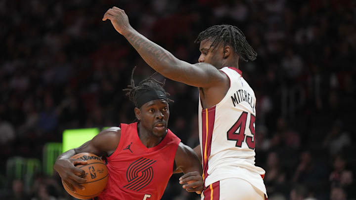 Nov 8, 2025; Miami, Florida, USA; Portland Trail Blazers guard Jrue Holiday (5) drives to the basket as Miami Heat guard Davion Mitchell (45) defends during the second half at Kaseya Center. Mandatory Credit: Jim Rassol-Imagn Images Nov 8, 2025; Miami, Florida, USA; Portland Trail Blazers guard Jrue Holiday (5) drives to the basket as Miami Heat guard Davion Mitchell (45) defends during the second half at Kaseya Center. Mandatory Credit: Jim Rassol-Imagn Images