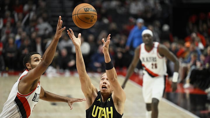 Oct 18, 2024; Portland, Oregon, USA; Utah Jazz guard Jason Preston (10) reaches for a rebound during the second half against Portland Trail Blazers forward Kris Murray (24) at Moda Center. Mandatory Credit: Troy Wayrynen-Imagn Images Oct 18, 2024; Portland, Oregon, USA; Utah Jazz guard Jason Preston (10) reaches for a rebound during the second half against Portland Trail Blazers forward Kris Murray (24) at Moda Center. Mandatory Credit: Troy Wayrynen-Imagn Images