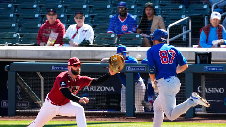 Arizona Diamondbacks first baseman Christian Walker (53) makes the out on Chicago Cubs Jake Slaughter (87) in the third inning during a spring training game at Salt River Fields on Feb. 27, 2023. Arizona Diamondbacks first baseman Christian Walker (53) makes the out on Chicago Cubs Jake Slaughter (87) in the third inning during a spring training game at Salt River Fields on Feb. 27, 2023.