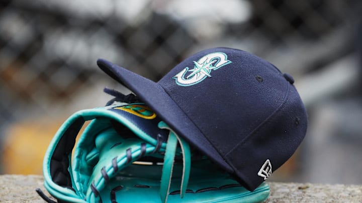 Hat and glove of Seattle Mariners center fielder Dee Gordon (9) sits in dugout during the third inning against the Detroit Tigers at Comerica Park. 