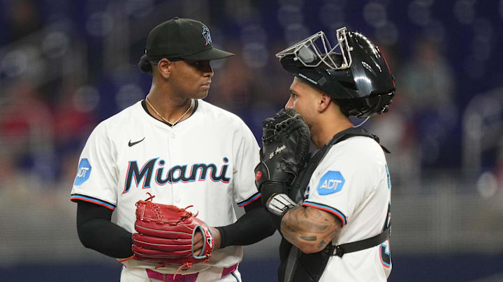 Aug 19, 2025; Miami, Florida, USA;  Miami Marlins pitcher Edward Cabrera (27) gets a visit from catcher Agustín Ramírez (50) in the first inning against the St. Louis Cardinals at loanDepot Park. Mandatory Credit: Jim Rassol-Imagn Images