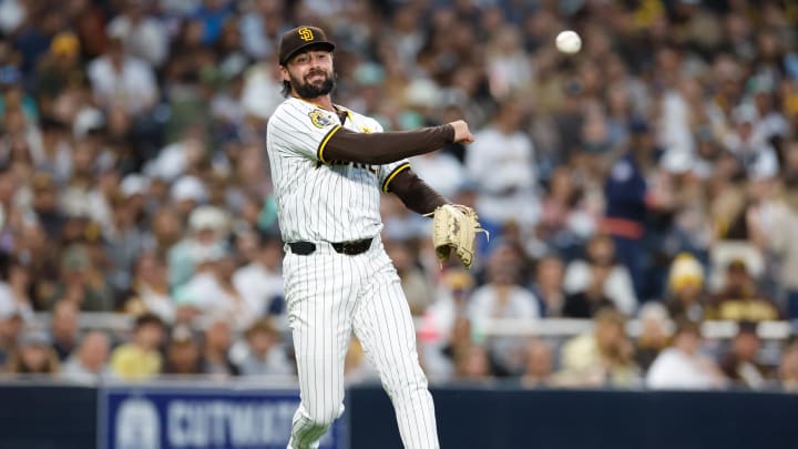 May 28, 2024; San Diego, California, USA; San Diego Padres starting pitcher Matt Waldron (61) fields the ball and throws to first for the out during the fifth inning against the Miami Marlins at Petco Park. Mandatory Credit: David Frerker-USA TODAY Sports