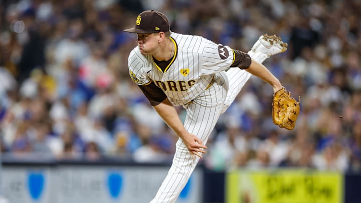 Jul 30, 2024; San Diego, California, USA; San Diego Padres relief pitcher Stephen Kolek (32) throws a pitch during the sixth inning against the Los Angeles Dodgers at Petco Park. Mandatory Credit: David Frerker-Imagn Images Jul 30, 2024; San Diego, California, USA; San Diego Padres relief pitcher Stephen Kolek (32) throws a pitch during the sixth inning against the Los Angeles Dodgers at Petco Park. Mandatory Credit: David Frerker-Imagn Images
