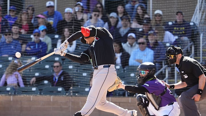 Arizona Diamondbacks' Nolan Arenado (28) hits a home run off Colorado Rockies pitcher Antonio Senzatela (49) in the second inning during a spring training game at Salt River Fields on Feb. 20, 2026, in Scottsdale.