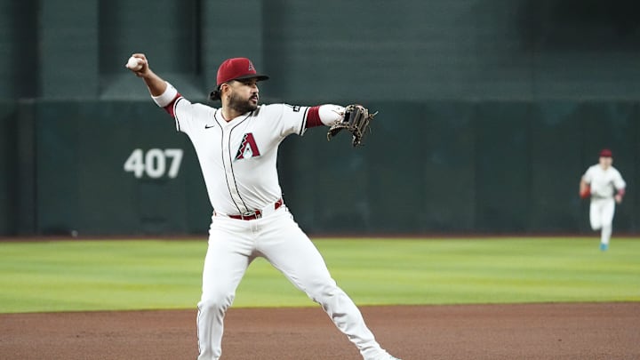 Arizona Diamondbacks third baseman Eugenio Suarez fields the ball and throws out Houston Astros' Yainer Diaz in the first inning at Chase Field in Phoenix on July 23, 2025.