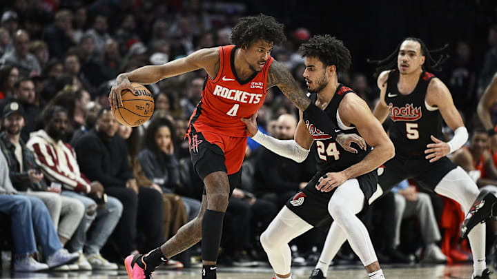 Apr 12, 2024; Portland, Oregon, USA; Houston Rockets guard Jalen Green (4) dribbles the ball during the second half against Portland Trail Blazers forward Justin Minaya (24) at Moda Center. Mandatory Credit: Troy Wayrynen-Imagn Images