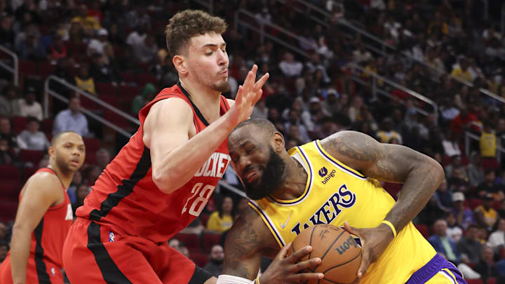 Mar 9, 2022; Houston, Texas, USA; Los Angeles Lakers forward LeBron James (6) drives against Houston Rockets center Alperen Sengun (28) in the fourth quarter at Toyota Center. Houston Rockets won 139 to 130. Mandatory Credit: Thomas Shea-Imagn Images