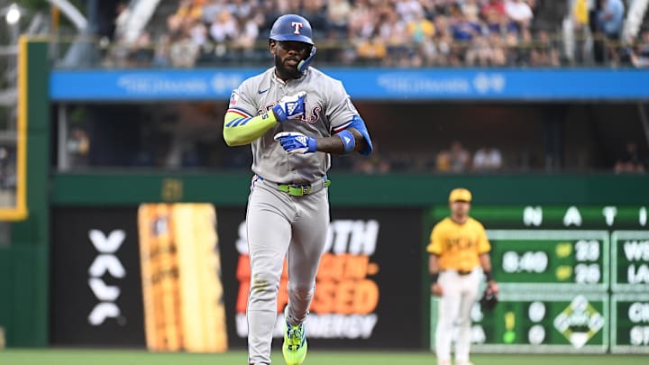 Jun 11, 2025; Pittsburgh, Pennsylvania, USA; Texas Rangers right fielder Adolis Garcia Celebrates after hitting a solo home run against the Pittsburgh Pirates during the fourth inning at PNC Park. Mandatory Credit: Philip G. Pavely-Imagn Images