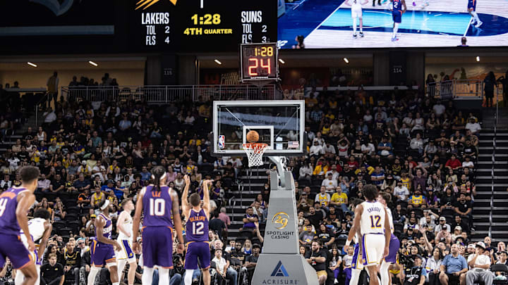 Oct 6, 2024; Palm Desert, California, USA;   Phoenix Suns guard Collin Gillespie (12) shoots a free throw against the Los Angeles Lakers during the second half at Acrisure Arena. Mandatory Credit: David Frerker-Imagn Images