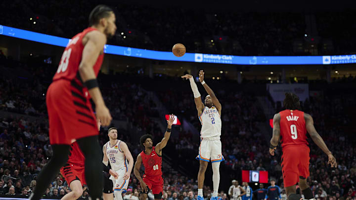 Jan 26, 2025; Portland, Oregon, USA; Oklahoma City Thunder guard Shai Gilgeous-Alexander (2) shoots a jump shot during the second half against Portland Trail Blazers guard Scoot Henderson (00) at Moda Center. Mandatory Credit: Troy Wayrynen-Imagn Images