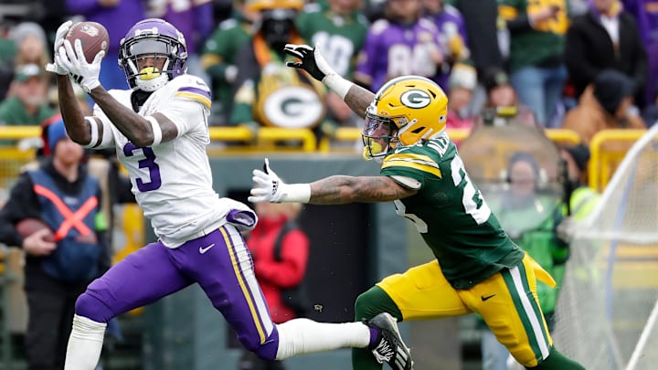 Minnesota Vikings wide receiver Jordan Addison (3) catches a pass against Green Bay Packers cornerback Jaire Alexander (23) during their football game Sunday, October 29, 2023, at Lambeau Field in Green Bay, Wis. Minnesota defeated Green Bay 24-10