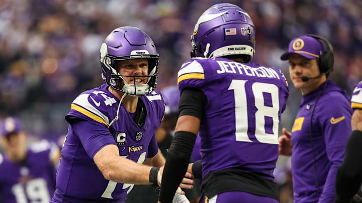 Dec 8, 2024; Minneapolis, Minnesota, USA; Minnesota Vikings quarterback Sam Darnold (14) celebrates his touchdown pass to wide receiver Justin Jefferson (18) against the Atlanta Falcons during the second quarter at U.S. Bank Stadium. Mandatory Credit: Matt Krohn-Imagn Images Dec 8, 2024; Minneapolis, Minnesota, USA; Minnesota Vikings quarterback Sam Darnold (14) celebrates his touchdown pass to wide receiver Justin Jefferson (18) against the Atlanta Falcons during the second quarter at U.S. Bank Stadium. Mandatory Credit: Matt Krohn-Imagn Images