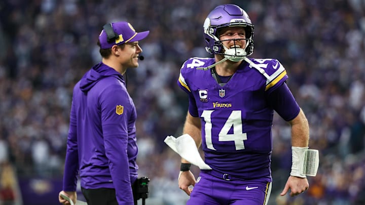 Dec 8, 2024; Minneapolis, Minnesota, USA; Minnesota Vikings quarterback Sam Darnold (14) celebrates running back Aaron Jones' (33) touchdown run with head coach Kevin O'Connell during the fourth quarter against the Atlanta Falcons at U.S. Bank Stadium. Mandatory Credit: Matt Krohn-Imagn Images