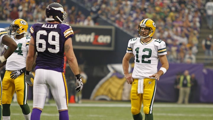 Oct 23, 2011; Minneapolis, MN, USA; Green Bay Packers quarterback Aaron Rodgers (12) talks with Minnesota Vikings defensive end Jared Allen (69) during a break on the field in the second quarter at the Metrodome. Mandatory Credit: Bruce Kluckhohn-Imagn Images Oct 23, 2011; Minneapolis, MN, USA; Green Bay Packers quarterback Aaron Rodgers (12) talks with Minnesota Vikings defensive end Jared Allen (69) during a break on the field in the second quarter at the Metrodome. Mandatory Credit: Bruce Kluckhohn-Imagn Images