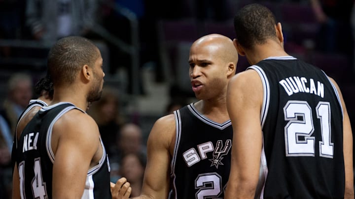 Feb 14, 2012; Auburn Hills, MI, USA; San Antonio Spurs small forward Richard Jefferson (center) talks to point guard Gary Neal (left) and center Tim Duncan (21) during the fourth quarter at The Palace. Spurs defeated the Pistons 99-95. Mandatory Credit: Tim Fuller-Imagn Images