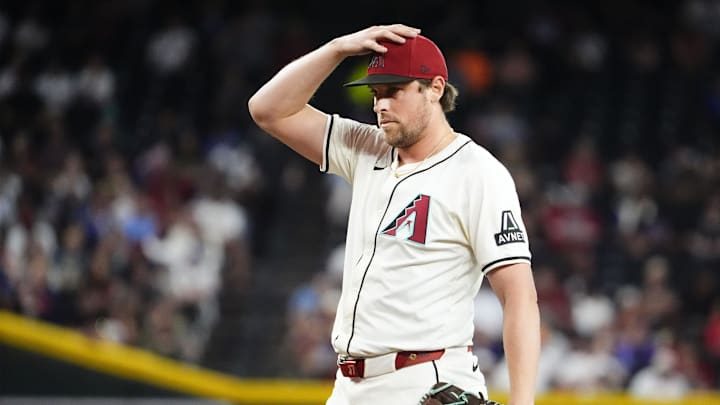 Arizona Diamondbacks pitcher Kevin Ginkel reacts after allowing Houston Astros' Christian Walker to hit the game-winning RBI-single in the ninth inning at Chase Field in Phoenix on July 23, 2025.