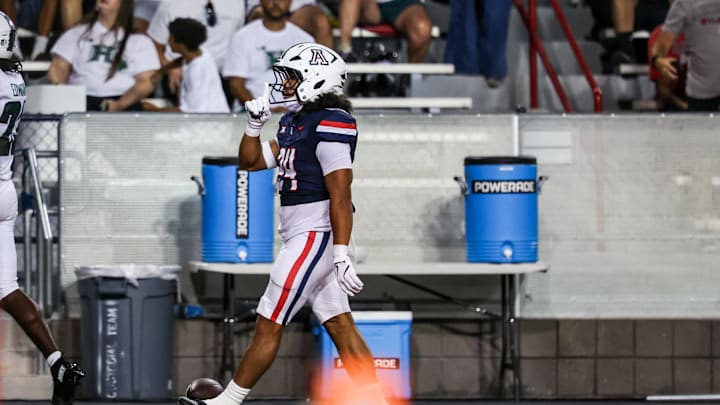Aug 30, 2025; Tucson, Arizona, USA; Arizona Wildcats running back Quincy Craig (24) holds up his finger after scoring a touchdown against the Hawaii Rainbow Warriors during the second quarter at Arizona Stadium. Mandatory Credit: Aryanna Frank-Imagn Images