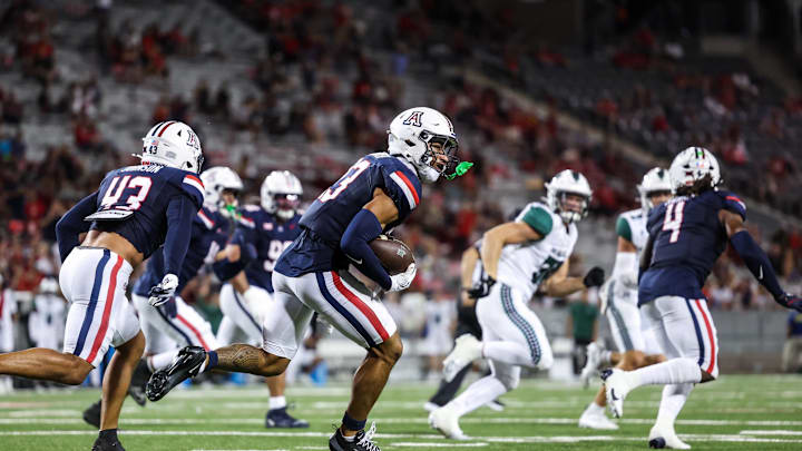 Aug 30, 2025; Tucson, Arizona, USA; Arizona Wildcats defensive back Gavin Hunter (23) intercepts the ball from the Hawaii Rainbow Warriors and runs during the fourth quarter of the game at Arizona Stadium. Mandatory Credit: Aryanna Frank-Imagn Images