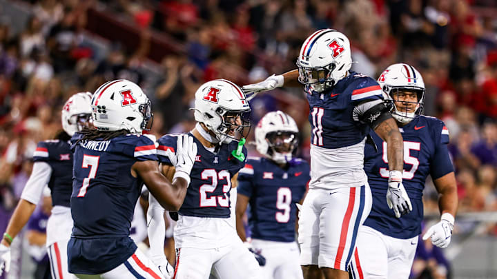 Sep 12, 2025; Tucson, Arizona, USA; Arizona Wildcats defensive back Gavin Hunter (23) celebrates with teammate during the fourth quarter against the Kansas State Wildcats at Arizona Stadium. Mandatory Credit: Aryanna Frank-Imagn Images