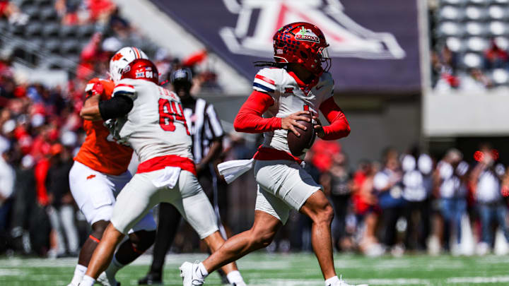 Oct 4, 2025; Tucson, Arizona, USA; Arizona Wildcats quarterback Noah Fifita (1) looks to pass the ball against the Oklahoma State Cowboys during the first quarter at Arizona Stadium. Mandatory Credit: Aryanna Frank-Imagn Images