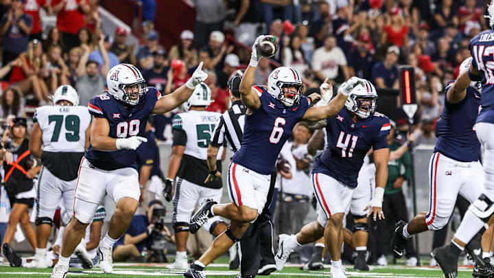 Aug 30, 2025; Tucson, Arizona, USA; Arizona Wildcats linebacker Taye Brown (6) celebrates after he intercepts the ball from the Hawaii Rainbow Warriors during the third quarter of the game at Arizona Stadium. Mandatory Credit: Aryanna Frank-Imagn Images
