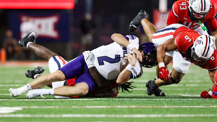 Sep 6, 2025; Tucson, Arizona, USA; Weber State Wildcats quarterback Jackson Gilkey (2) gets tackled by the Arizona Wildcats during the second quarter of the game at Arizona Stadium. Mandatory Credit: Aryanna Frank-Imagn Images Sep 6, 2025; Tucson, Arizona, USA; Weber State Wildcats quarterback Jackson Gilkey (2) gets tackled by the Arizona Wildcats during the second quarter of the game at Arizona Stadium. Mandatory Credit: Aryanna Frank-Imagn Images