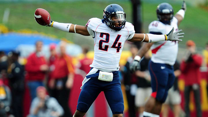 December 5, 2009; Los Angeles, CA, USA; Arizona Wildcats cornerback Trevin Wade (24) celebrates after intercepting a pass against the Southern California Trojans during the first half at the Los Angeles Memorial Coliseum. Mandatory Credit: Gary A. Vasquez-Imagn Images December 5, 2009; Los Angeles, CA, USA; Arizona Wildcats cornerback Trevin Wade (24) celebrates after intercepting a pass against the Southern California Trojans during the first half at the Los Angeles Memorial Coliseum. Mandatory Credit: Gary A. Vasquez-Imagn Images