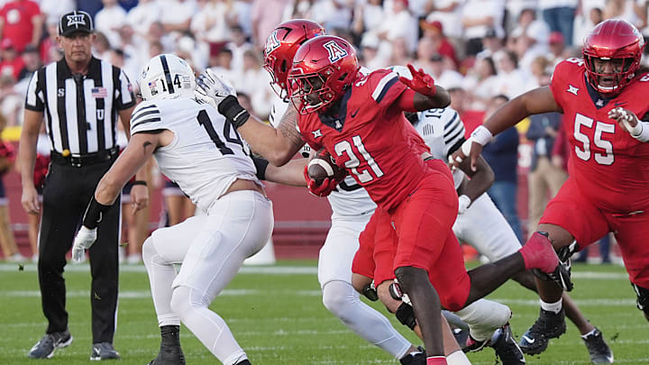 Arizona Wildcats running back Ismail Mahdi (21)runs with the ball against Iowa state during the first quarter in the Big-12 conference showdown on Sept. 27, 2025, at Jack Trice Stadium in Ames, Iowa. Arizona Wildcats running back Ismail Mahdi (21)runs with the ball against Iowa state during the first quarter in the Big-12 conference showdown on Sept. 27, 2025, at Jack Trice Stadium in Ames, Iowa.