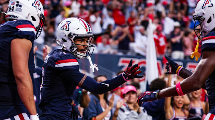 Oct 11, 2025; Tucson, Arizona, USA; Arizona Wildcats wide receiver Kris Hutson (4) celebrates a touchdown he made during the first quarter of the game against the Brigham Young Cougars at Arizona Stadium. Mandatory Credit: Aryanna Frank-Imagn Images