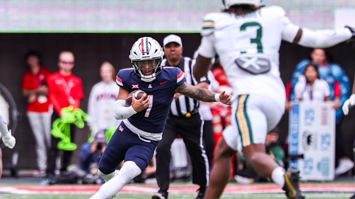 Nov 22, 2025; Tucson, Arizona, USA; Arizona Wildcats quarterback Noah Fifita (1) runs with the ball during the third quarter of the game against the Baylor Bears at Casino Del Sol Stadium. Mandatory Credit: Aryanna Frank-Imagn Images Nov 22, 2025; Tucson, Arizona, USA; Arizona Wildcats quarterback Noah Fifita (1) runs with the ball during the third quarter of the game against the Baylor Bears at Casino Del Sol Stadium. Mandatory Credit: Aryanna Frank-Imagn Images