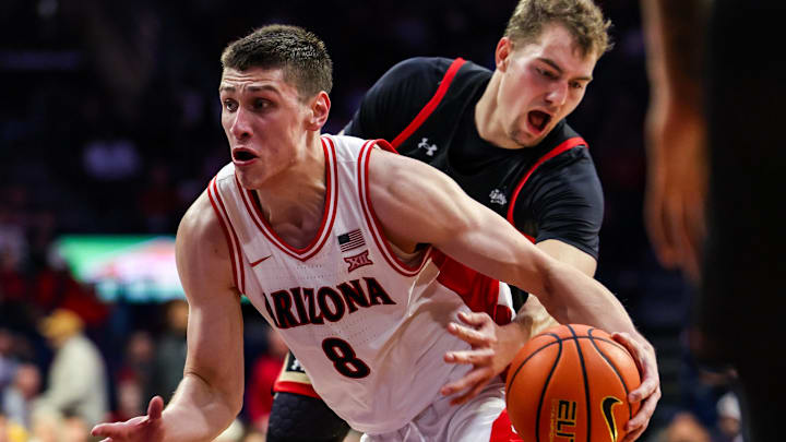Nov 24, 2025; Tucson, Arizona, USA; Arizona Wildcats forward Ivan Kharchenkov (8) dribbles the ball during the second half of the game against the Denver Pioneers at McKale Memorial Center. Mandatory Credit: Aryanna Frank-Imagn Images
